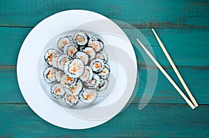 Sushi maki gunkan roll plate and chopsticks