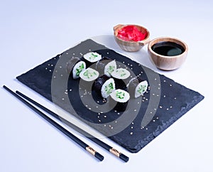 Sushi Maki rolls cucumber. Fresh hosomaki pieces with rice and nori. Close Up of delicious japanese food with sushi roll