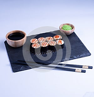 Sushi Maki rolls salmon. Fresh hosomaki pieces with rice and nori. Close Up of delicious japanese food with sushi roll