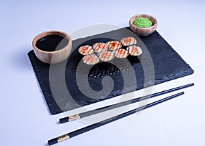 Sushi Maki rolls salmon. Fresh hosomaki pieces with rice and nori. Close Up of delicious japanese food with sushi roll
