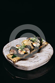 Sushi Mansa Maki decorated with microgreens