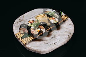 Sushi Mansa Maki on a stone tray