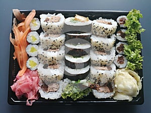Sushi mix Japanese dish in plastic packaging