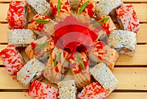 Sushi mix on the wooden background