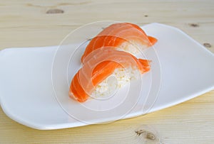 Sushi, nigiri, sake a dish of the traditional Japanese cuisine cooked from rice and a salmon.
