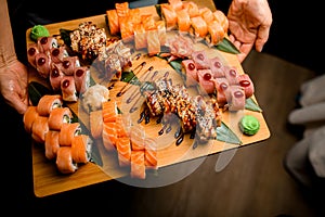 Sushi Palette. Tuna, Sesame, Teriyaki Rolls on Leafy Bedrock