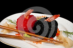 Sushi with prawns, red and black fish eggs.