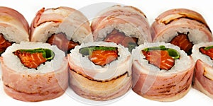 Sushi roll with bacon and salmon on a white background, ingredients seared bacon, salmon, green onions, flying fish roe, Iceberg