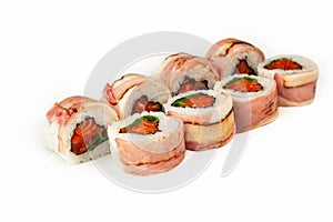 Sushi roll with bacon and salmon on a white background, ingredients seared bacon, salmon, green onions, flying fish roe, Iceberg