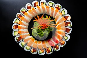 a sushi roll cut into pieces displayed in a circular pattern
