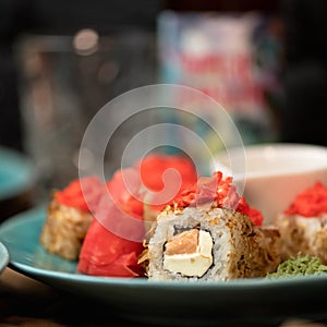 Sushi roll decorated with masago or tobiko caviar. Inside-out Sushi Set. Traditional Japanese food. Healthy Oriental