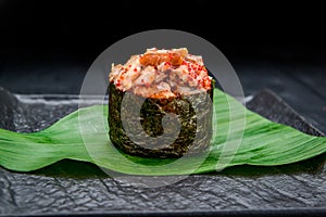 Sushi roll gunkan with smoked eel and caviar