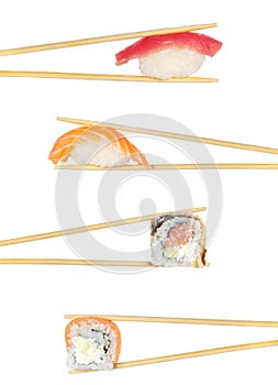 Sushi roll and nigiri sushi roll in chopsticks isolated