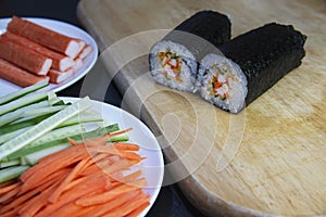 Sushi roll preparing