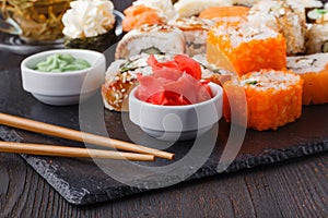 Sushi Roll with salmon, eel, tuna, avocado, cream cheese Philadelphia, caviar tobica, chuka. Sushi menu. Japanese food on table