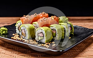 Sushi roll with salmon, smoked eel, avocado, cream cheese on a black background. Sushi menu. Japanese food.