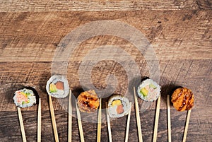 Sushi roll set with chopsticks.