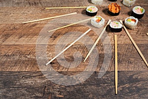 Sushi roll set with chopsticks. Japan sun concept.