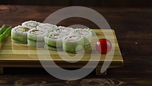 Sushi roll set on the table. Various Japanese dishes are served at the restaurant. Set with salmon, tuna, vegetables