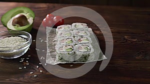 Sushi roll set on the table. Various Japanese dishes are served at the restaurant. Set with salmon, tuna, vegetables