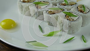 Sushi roll set on the table. Various Japanese dishes are served at the restaurant. Set with salmon, tuna, vegetables