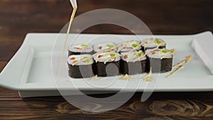 Sushi roll set on the table. Various Japanese dishes are served at the restaurant. Set with salmon, tuna, vegetables