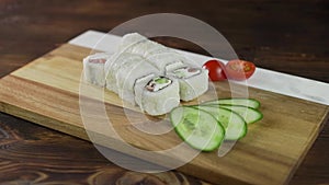 Sushi roll set on the table. Various Japanese dishes are served at the restaurant. Set with salmon, tuna, vegetables