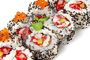 Sushi roll with shrimp, flying fish roe, salmon and black sesame