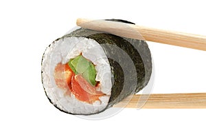 Sushi rolls with avocado, salmon and spicy sauce. Chopsticks.