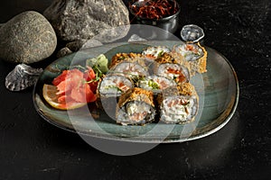 Sushi rolls baked in batter with salmon and salad