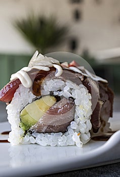 Sushi rolls Japanese food. California sushi roll with tuna, avocado. Japanese restaurant menu