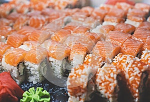 Sushi rolls philadelphia green maden from fresh salmon, cream cheese, cucumber, avocado.