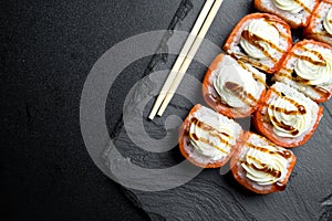 Sushi rolls Philadelphia with salmon and topped with cream cheese