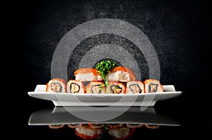 Sushi and rolls in plate