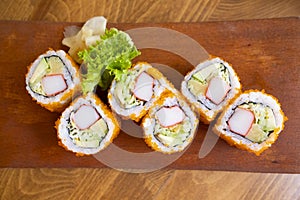 Sushi rolls plate, sushi rolls are traditional Japanese seafood, close up photo.