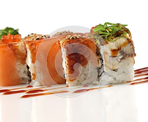 Sushi rolls with salmon, eel fish, wakame seaweed