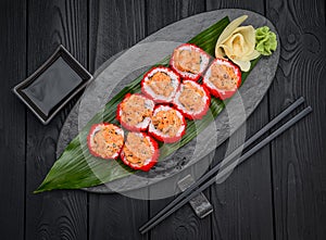 Sushi rolls with salmon tempura and tobiko caviar