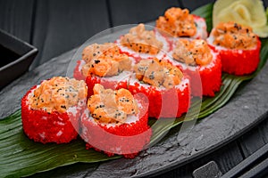 Sushi rolls with salmon tempura and tobiko caviar