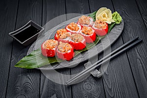 Sushi rolls with salmon tempura and tobiko caviar