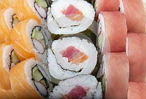 Sushi rolls with salmon and tuna , close up shot