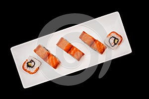 Sushi and rolls set on black background