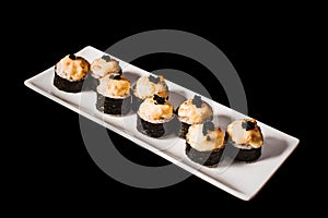 Sushi and rolls set on black background