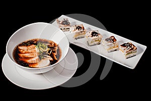 Sushi and rolls set on black background