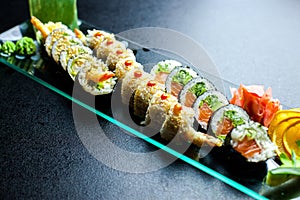 Sushi rolls set served on glass plate