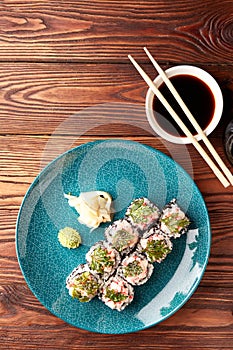 Sushi rolls with shrimps and parsley chips