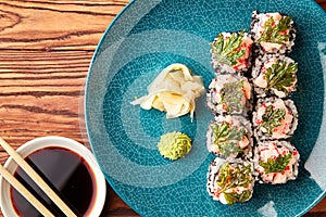 Sushi rolls with shrimps and parsley chips