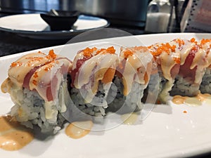 Sushi rolls - tuna salmon mix with fish roe, sauce, rice, seaweed (sexy girl roll)