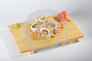 Sushi rolls on wooden tray