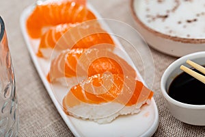 Sushi sake nigiri with salmon served on platter photo