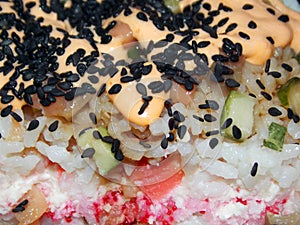 Sushi salad with salmon, rice, ginger, fresh cucumber and creamy sauce